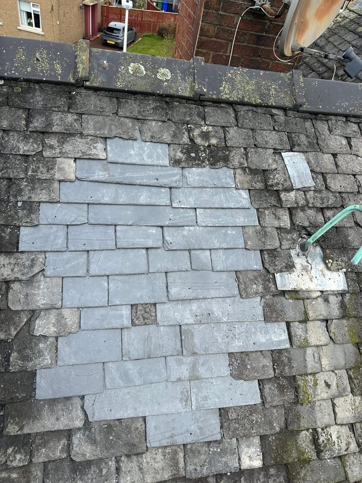The opening slated over with new blue-grey slates among the old weathered ones