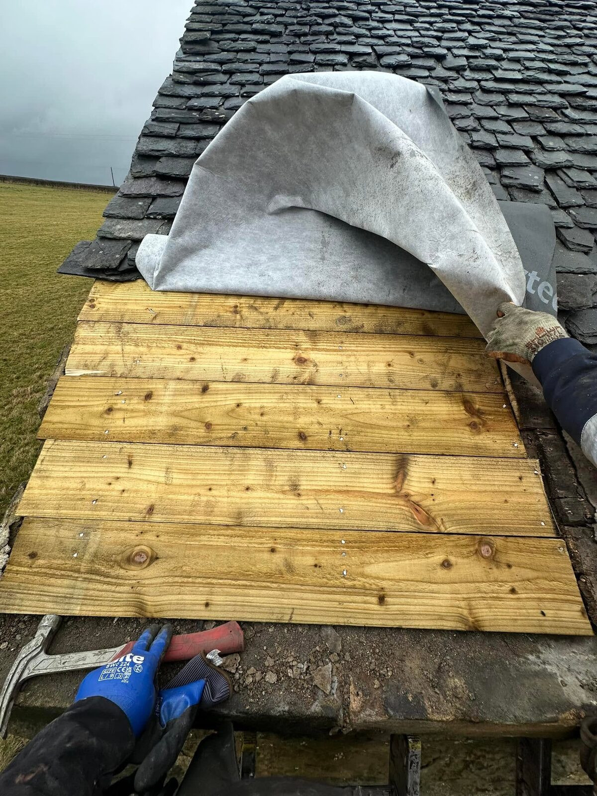 New timber sarking boards nailed in at the eaves
